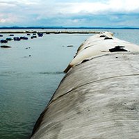 Teletube Protection des côtes et plages  – Géotextile tissé de coffrage. - Batiweb